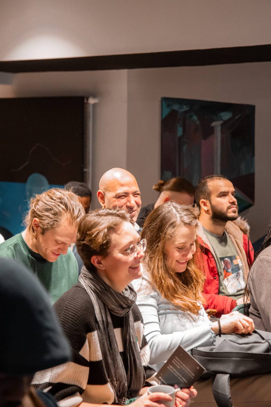Students smiling in the audience